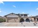 Inviting two-story home showcasing desert landscaping and a convenient two-car garage at 307 Balsa St, Henderson, NV 89002