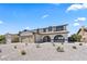 Charming two-story home featuring a two-car garage and low-maintenance desert landscaping at 307 Balsa St, Henderson, NV 89002