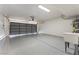 Spacious garage features epoxy floors, ample lighting, and utility sink at 307 Balsa St, Henderson, NV 89002