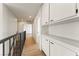 Upper hallway showcases wood floors, built-in storage, and bright lighting at 307 Balsa St, Henderson, NV 89002