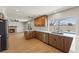 Modern kitchen with stainless steel appliances, wood cabinets, and view to the backyard pool at 307 Balsa St, Henderson, NV 89002