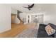 Spacious living area with hardwood floors, stairs, modern lighting, and comfortable seating at 307 Balsa St, Henderson, NV 89002