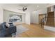 Comfortable living area with hardwood floors, modern lighting, stairs, and a large window at 307 Balsa St, Henderson, NV 89002