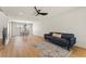 Open concept living area with hardwood floors, modern lighting, and comfortable seating at 307 Balsa St, Henderson, NV 89002