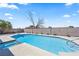 Inviting in-ground swimming pool with diving board and hot tub, perfect for outdoor relaxation and entertaining at 307 Balsa St, Henderson, NV 89002