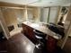 Luxurious bathroom featuring dual sinks, a marble countertop, and a walk-in shower at 3167 El Cedro Cir, Las Vegas, NV 89121