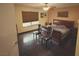 Bedroom featuring hardwood floors, windows with blinds, a ceiling fan, and natural light at 3167 El Cedro Cir, Las Vegas, NV 89121