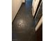 Unique flooring featuring black tile design with matching black trim along walls at 3167 El Cedro Cir, Las Vegas, NV 89121