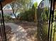 Front yard with stone walkway leading to a decorative gate at 3167 El Cedro Cir, Las Vegas, NV 89121