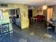 Combined kitchen and living area with stone accents and an open floor plan for easy entertaining at 3167 El Cedro Cir, Las Vegas, NV 89121