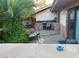 Outdoor kitchen with bar area, grill, and relaxing patio seating at 3167 El Cedro Cir, Las Vegas, NV 89121