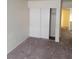 Bedroom with closet and worn gray carpet and neutral wall color at 3237 Perching Bird Ln, North Las Vegas, NV 89084