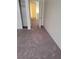 Bedroom featuring worn gray carpet and a closet with sliding doors at 3237 Perching Bird Ln, North Las Vegas, NV 89084
