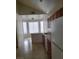 Cozy kitchen with wood cabinets, laminate counters, and a breakfast nook featuring large windows for plenty of natural light at 3237 Perching Bird Ln, North Las Vegas, NV 89084