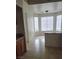 Eat-in kitchen area with natural light, tile flooring and breakfast bar at 3237 Perching Bird Ln, North Las Vegas, NV 89084