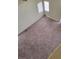 Carpeted loft area with natural light at 3237 Perching Bird Ln, North Las Vegas, NV 89084