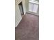 Carpeted loft area with natural light at 3237 Perching Bird Ln, North Las Vegas, NV 89084