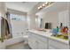 Bathroom featuring a shower tub combination, a white vanity with sink, and neutral decor and paint at 3359 Commendation Dr, Las Vegas, NV 89117