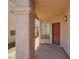 View of front door with neutral color and large pillar for support at 3359 Commendation Dr, Las Vegas, NV 89117