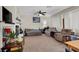 Spacious living area features a fireplace and large windows for natural light at 3359 Commendation Dr, Las Vegas, NV 89117