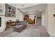 Open living area featuring a cozy fireplace and stairs to the second level at 3359 Commendation Dr, Las Vegas, NV 89117