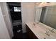 Bathroom featuring double sinks, tiled flooring, and walk-in shower at 3633 Monte Verde St, Las Vegas, NV 89121