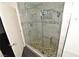 Bathroom showcasing glass enclosed shower with stone pebble floor and tiled walls at 3633 Monte Verde St, Las Vegas, NV 89121