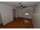 Comfortable bedroom with hardwood floors, closet space, and a ceiling fan, creating a cozy retreat at 3633 Monte Verde St, Las Vegas, NV 89121