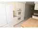 Well-equipped kitchen featuring white appliances, ample cabinetry, and a convenient island for prep work at 3633 Monte Verde St, Las Vegas, NV 89121