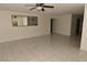 Bright living room showcasing neutral walls, tile flooring, and ample space for furniture at 3633 Monte Verde St, Las Vegas, NV 89121