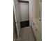 This bathroom features a walk-in closet, neutral tile and white vanity with storage at 3755 Chutney St, Las Vegas, NV 89121