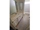 This bathroom features neutral tile, white cabinets, a vanity and shower/tub combo at 3755 Chutney St, Las Vegas, NV 89121