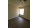 This bedroom features wood-look flooring and a window allowing for natural light at 3755 Chutney St, Las Vegas, NV 89121