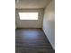 This bedroom features wood-look floors and a window allowing for natural light at 3755 Chutney St, Las Vegas, NV 89121