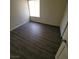 This bedroom has modern laminate flooring, a large window and closet at 3755 Chutney St, Las Vegas, NV 89121