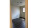 Bright bedroom features laminate flooring and a window with blinds at 3755 Chutney St, Las Vegas, NV 89121