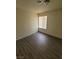Bright bedroom featuring laminate flooring and a window with blinds at 3755 Chutney St, Las Vegas, NV 89121