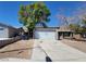 Street view of a single-story home with detached garage at 3755 Chutney St, Las Vegas, NV 89121