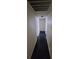 Hallway with laminate flooring leads to bedrooms and bathrooms at 3755 Chutney St, Las Vegas, NV 89121