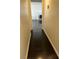 View down hallway leads to living room, complete with dark wood laminate flooring at 3755 Chutney St, Las Vegas, NV 89121