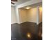 Open living area with hardwood floors, neutral walls and a double door closet at 3755 Chutney St, Las Vegas, NV 89121