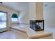 Bright bathroom with a jetted tub, fireplace, and a tiled floor at 399 Discovery Ct, Henderson, NV 89014