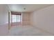 A simple bedroom with carpet, a window, and decorative wall paper at 399 Discovery Ct, Henderson, NV 89014