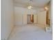 Spacious and carpeted bedroom with a double door entrance at 399 Discovery Ct, Henderson, NV 89014
