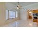 Bright dining area featuring tile floors and is open to the kitchen and living room at 399 Discovery Ct, Henderson, NV 89014