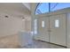 Inviting foyer showcasing double doors, tile flooring, and an open view into the living area at 399 Discovery Ct, Henderson, NV 89014