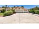 Charming single-story home showcasing a well-manicured front yard and a spacious three-car garage at 399 Discovery Ct, Henderson, NV 89014