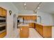 Bright kitchen with tile countertops and stainless steel appliances at 399 Discovery Ct, Henderson, NV 89014