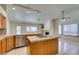 Island kitchen featuring cooktop and dining with view into the living room at 399 Discovery Ct, Henderson, NV 89014
