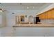 Open kitchen featuring tile countertops and modern stainless steel appliances at 399 Discovery Ct, Henderson, NV 89014